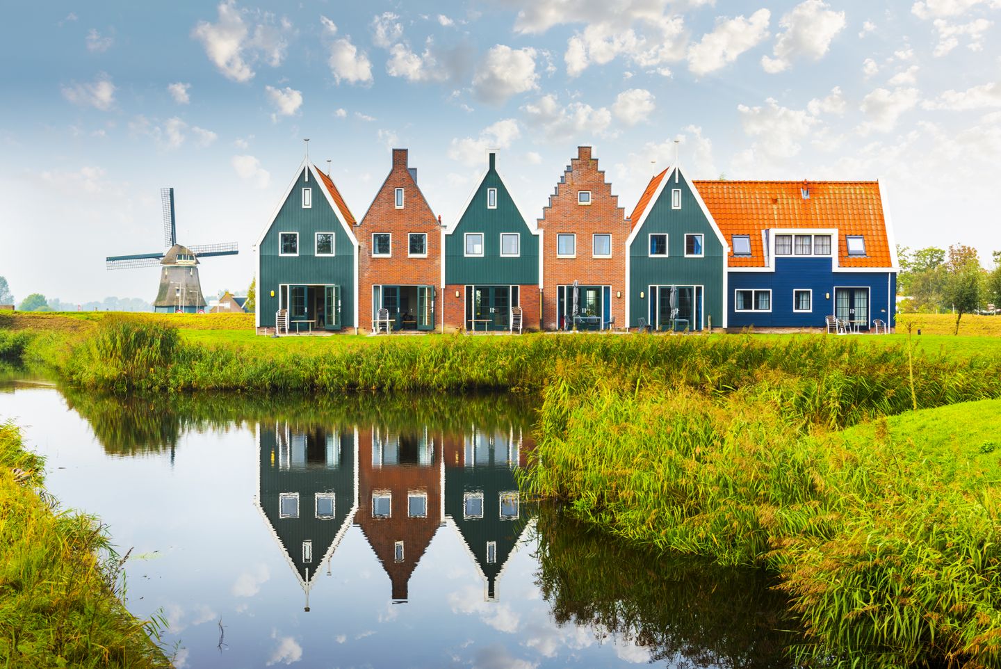 3 days in Amsterdam: a responsible travel itinerary Colourful wooden houses and a windmill in Volendam, the Netherlands
