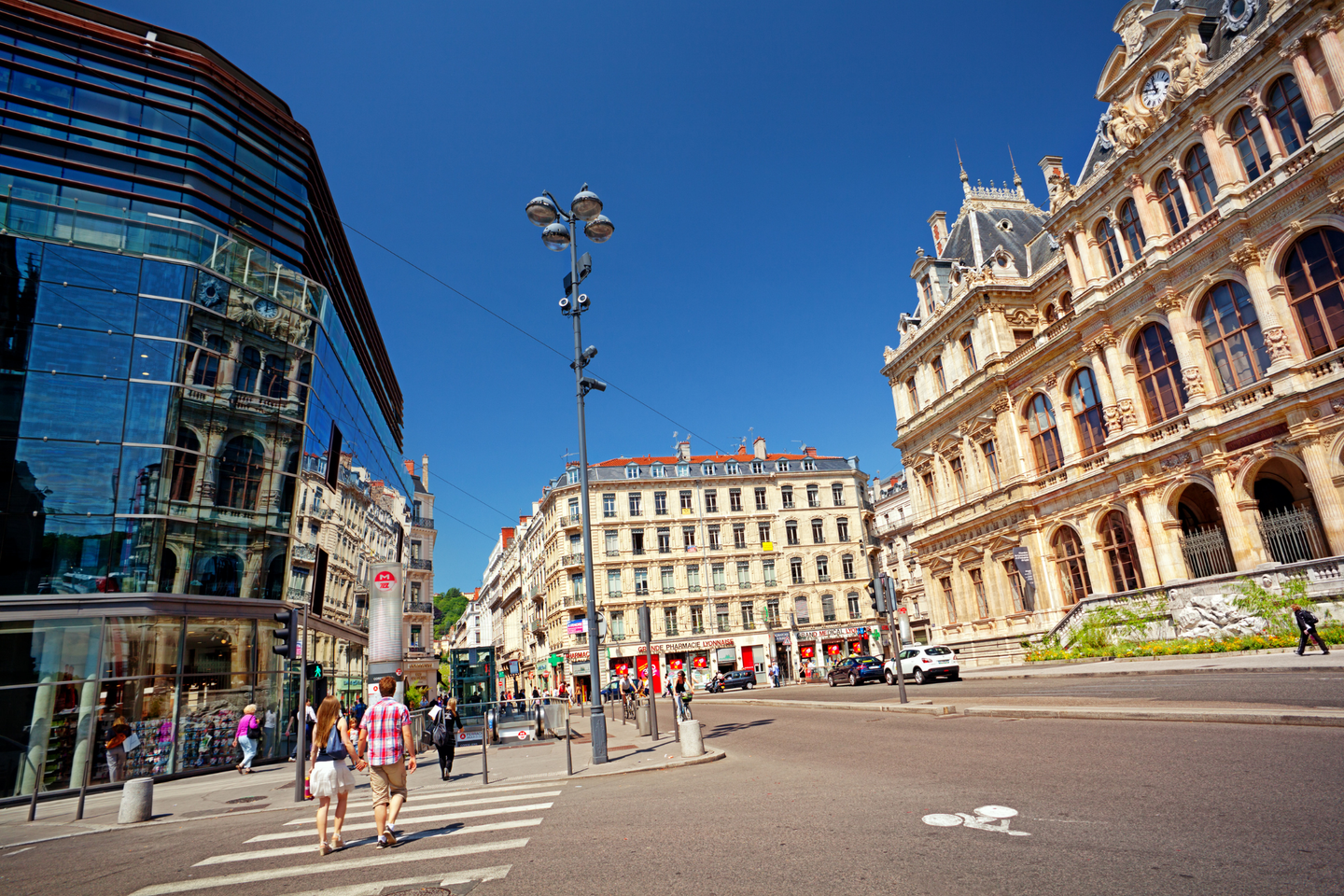 People walk on Place des Cordeliers square in the center of Lyon. 