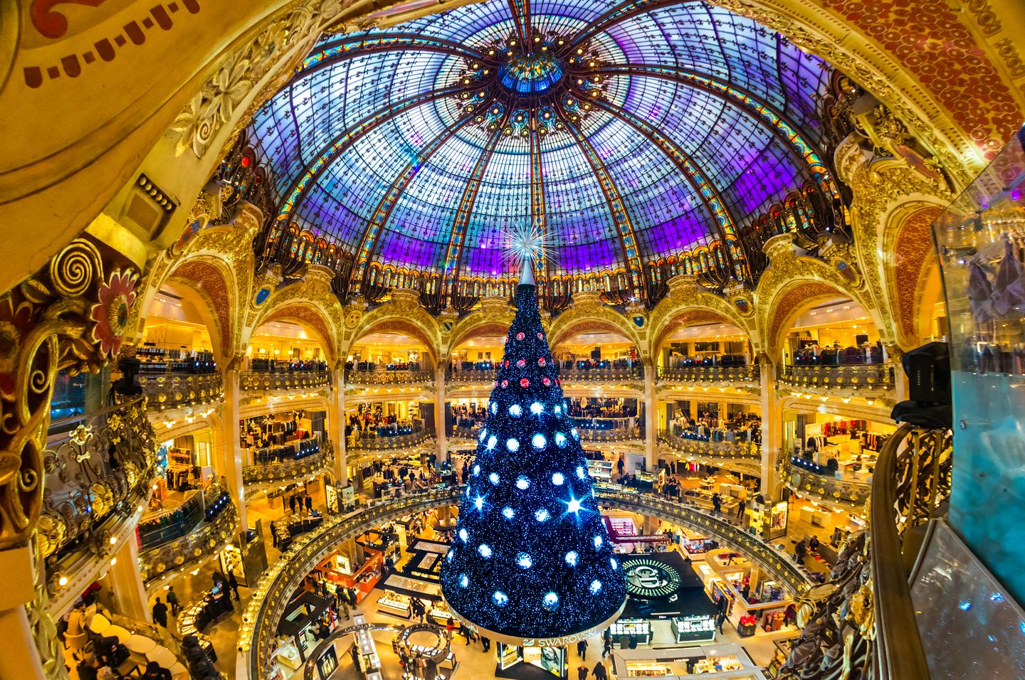 Christmas in France The Christmas tree and decorations at the Galeries Lafayette in Paris.