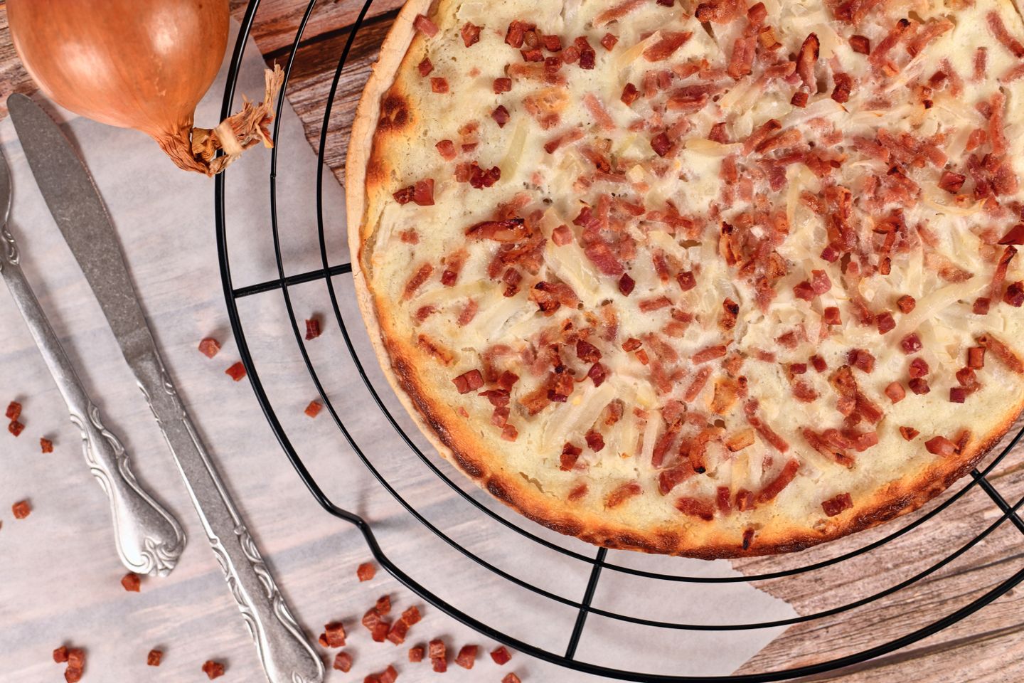 Delicious discoveries: 9 foods to try in Alsace Flammkuchen or tarte flambee, a traditional French pizza.