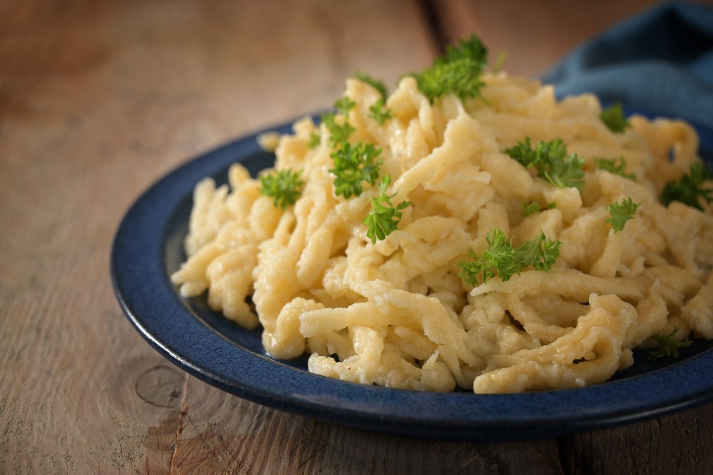 Delicious discoveries: 9 foods to try in Alsace Homemade spaetzle, German egg noodles with cheese served with parsley garnish